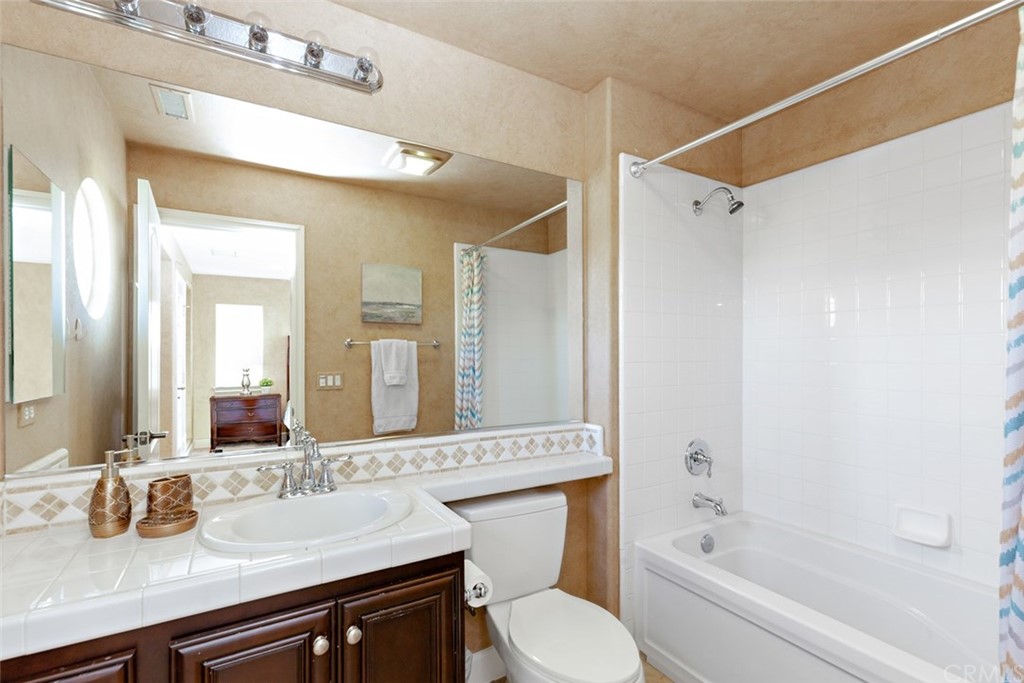 720 West Aster Place Santa Ana, CA 92706 - Photo 33 of 41 a bathroom with a sink a toilet and shower