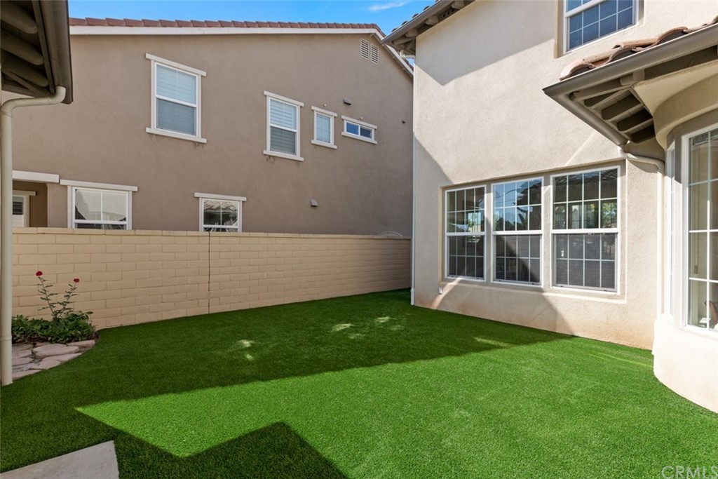 720 West Aster Place Santa Ana, CA 92706 - Photo 34 of 41 a view of an house with backyard space and garden