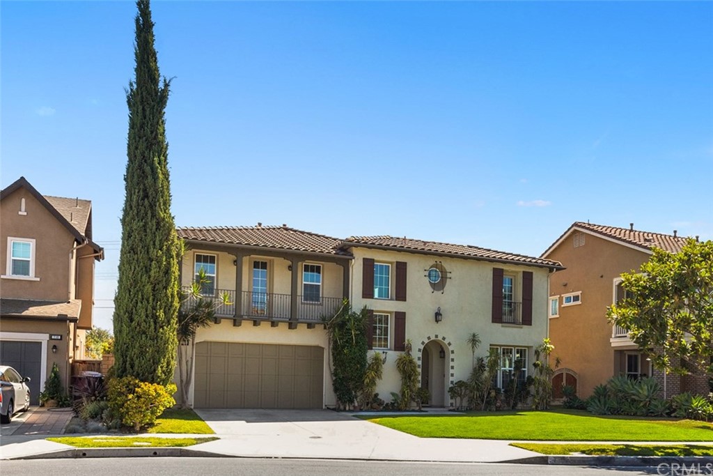 720 West Aster Place Santa Ana, CA 92706 - Photo 39 of 41 a front view of a house with garden