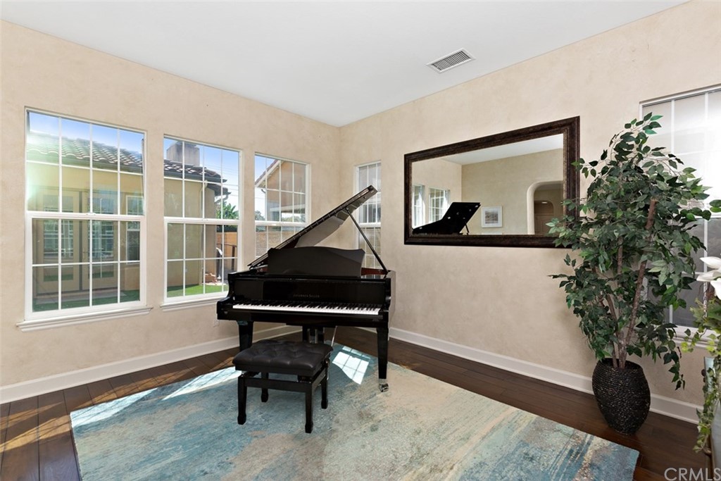 720 West Aster Place Santa Ana, CA 92706 - Photo 7 of 41 a living room with furniture and a potted plant
