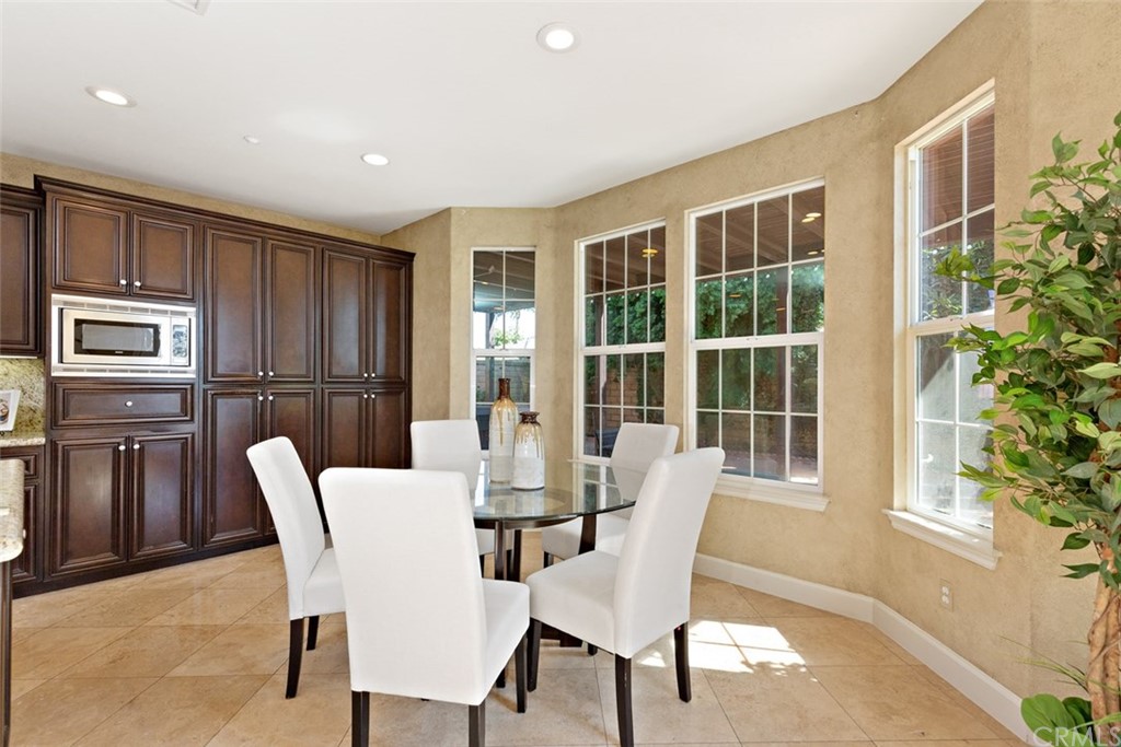720 West Aster Place Santa Ana, CA 92706 - Photo 9 of 41 a dining room with furniture and window