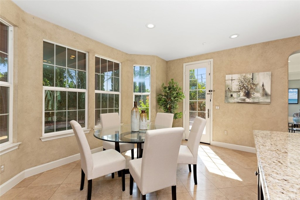 720 West Aster Place Santa Ana, CA 92706 - Photo 10 of 41 a view of a dining room with furniture and windows