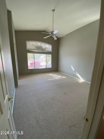 en empty room with windows and outdoor view