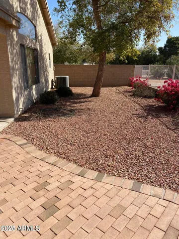 a view of a backyard with sitting area