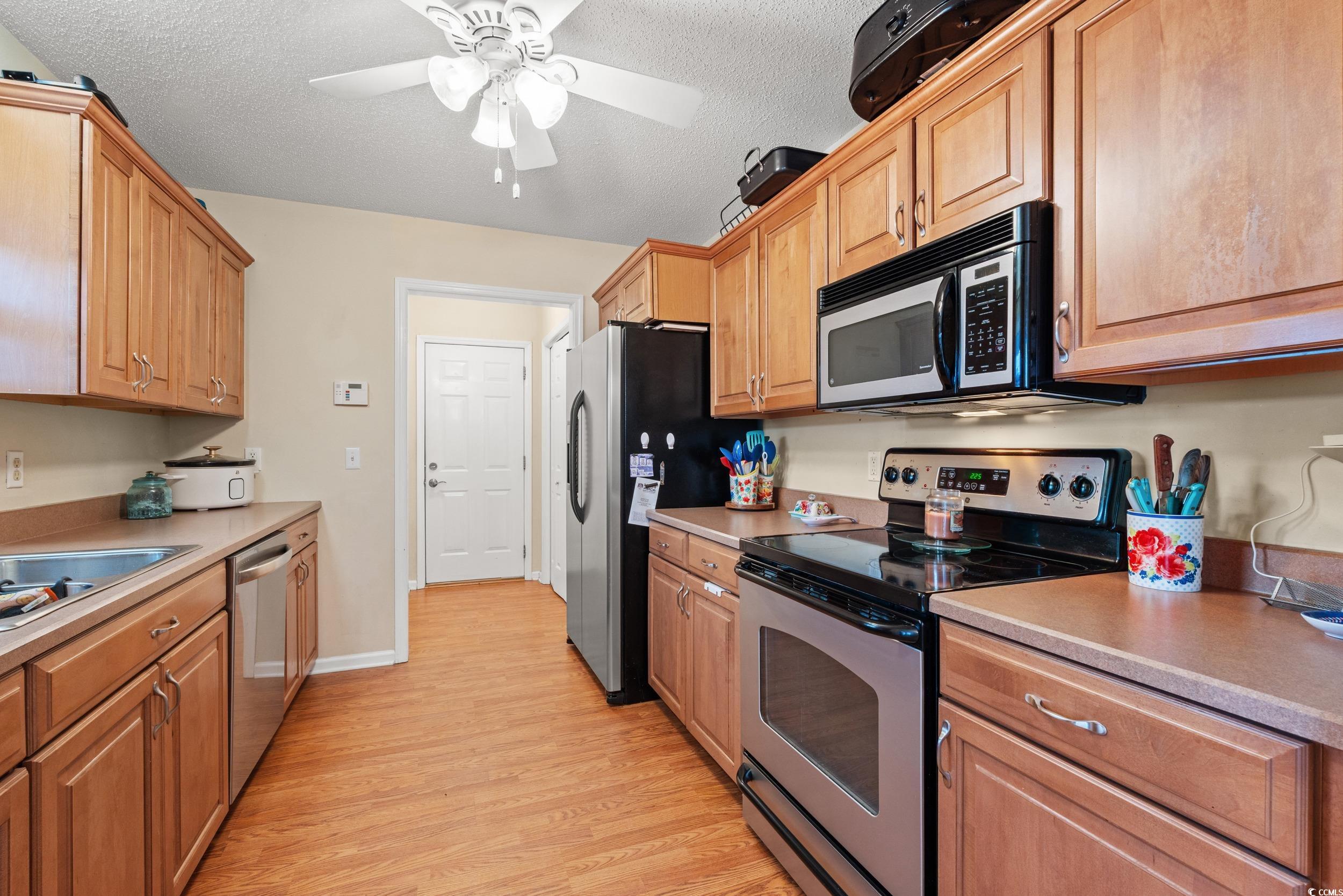 3471 Spivey Street Loris, SC 29569 - Photo 12 of 31 Kitchen with stainless steel appliances, ceiling f