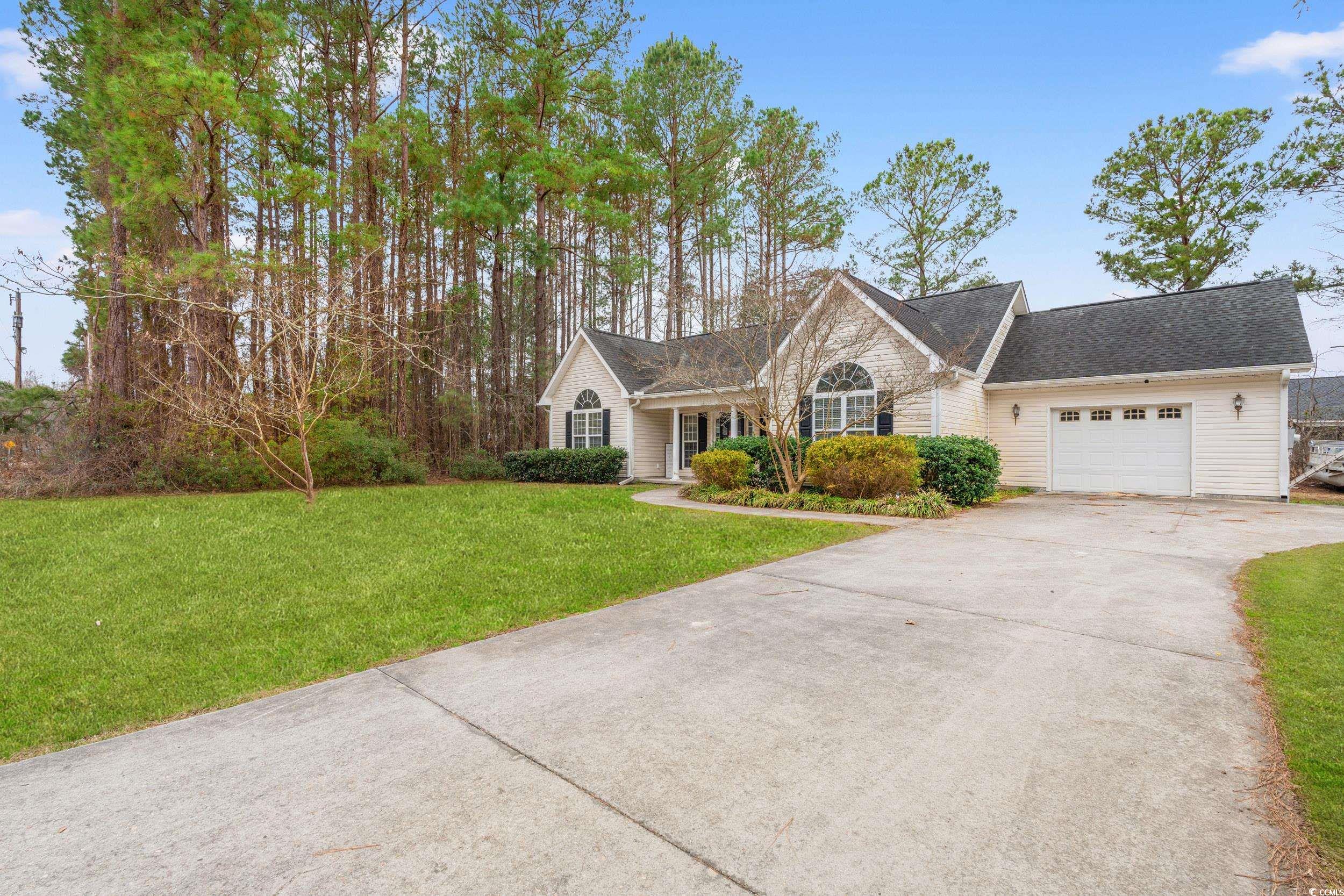3471 Spivey Street Loris, SC 29569 - Photo 2 of 31 View of front facade featuring a garage and a fron
