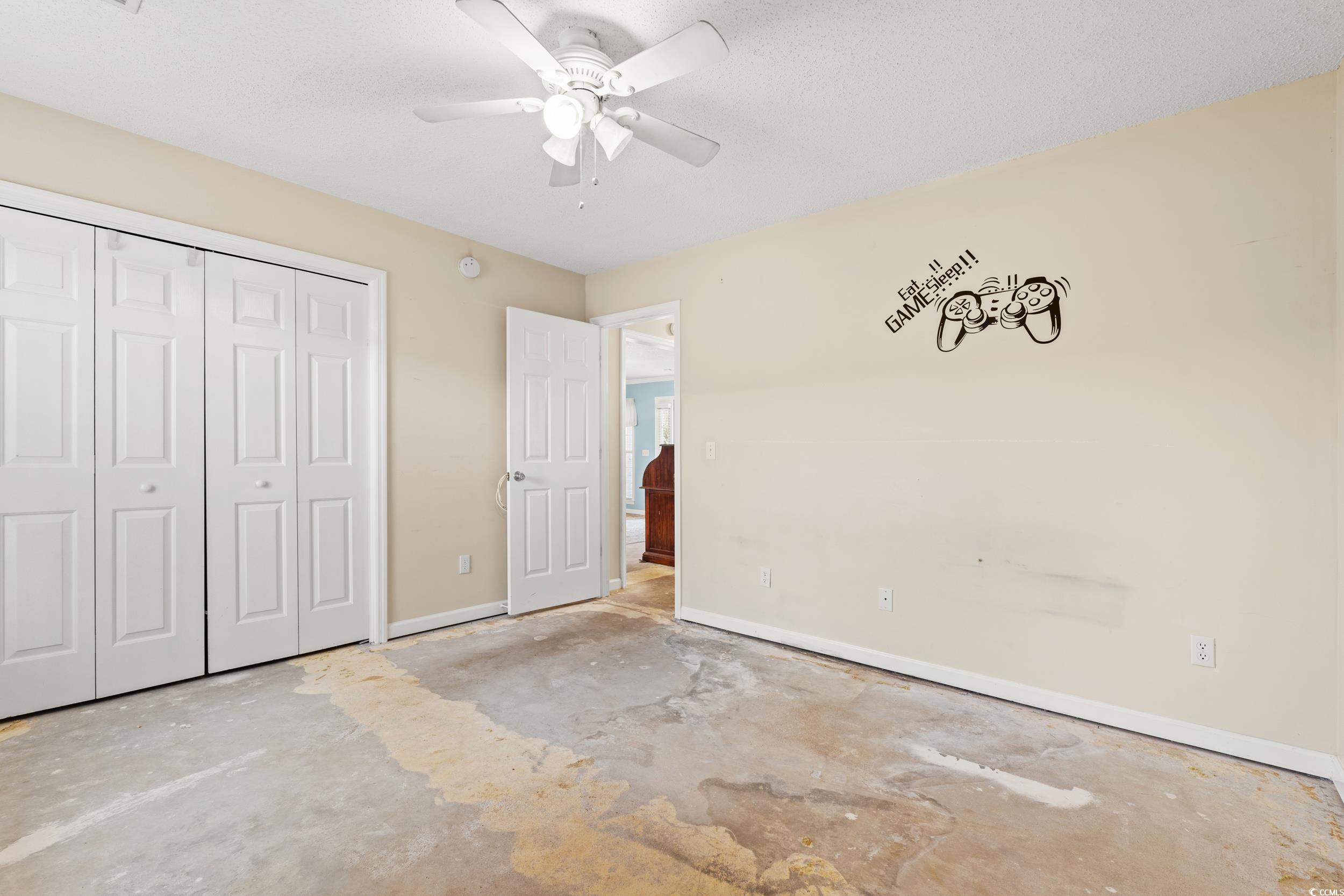 3471 Spivey Street Loris, SC 29569 - Photo 23 of 31 Unfurnished bedroom with a closet, concrete floors