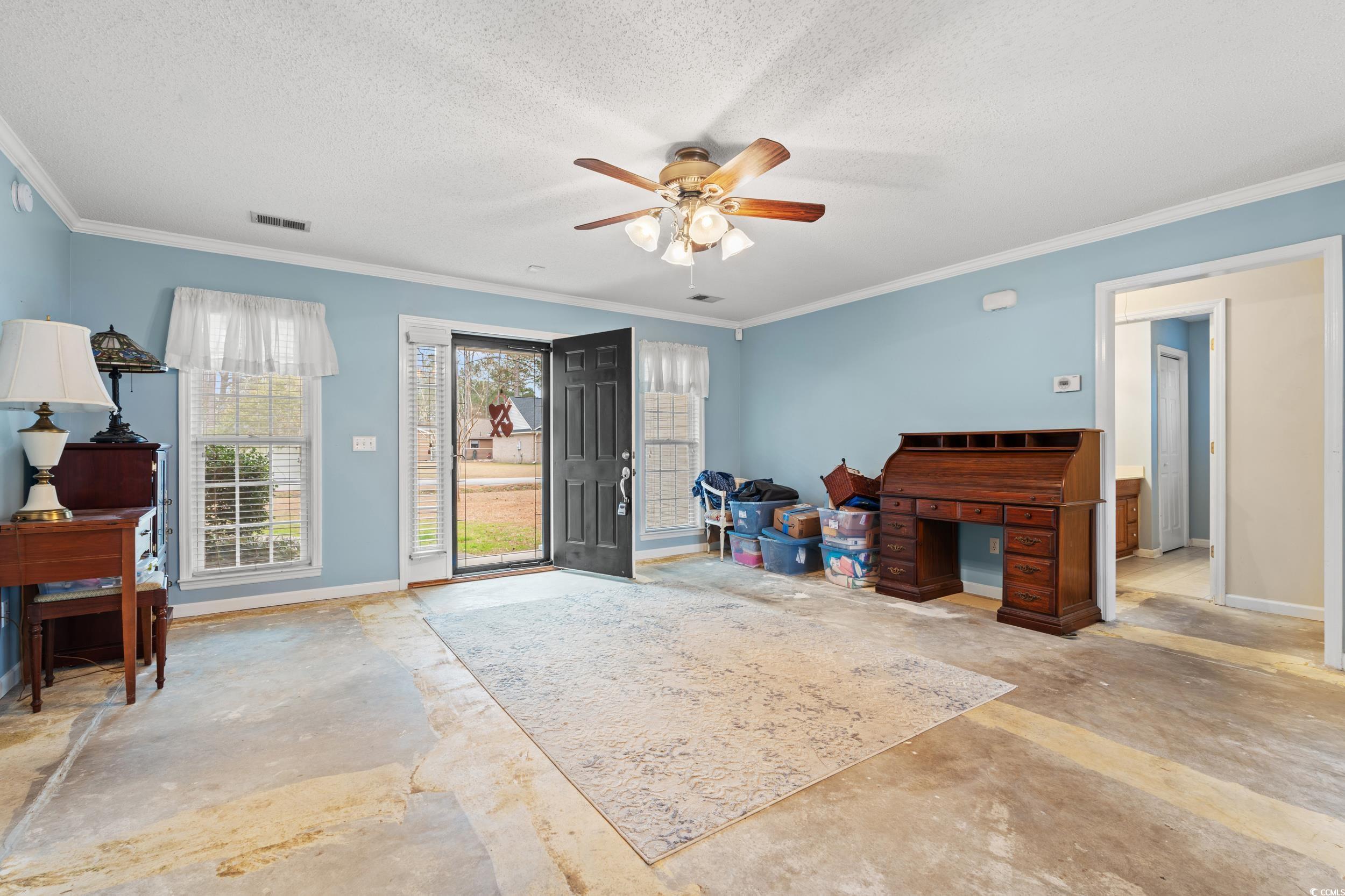 3471 Spivey Street Loris, SC 29569 - Photo 7 of 31 Interior space featuring ceiling fan, crown moldin