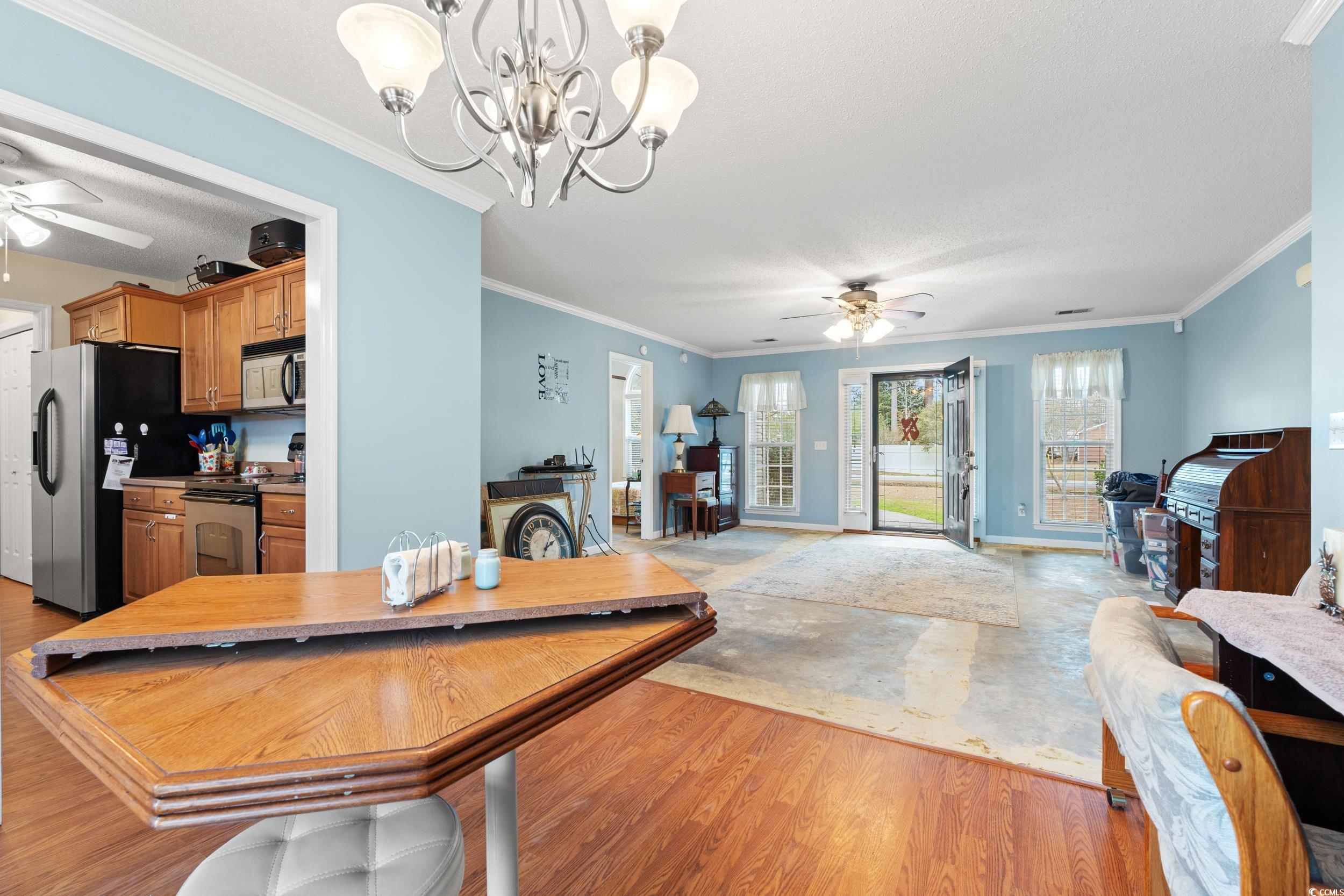 3471 Spivey Street Loris, SC 29569 - Photo 10 of 31 Dining room featuring crown molding, ceiling fan w