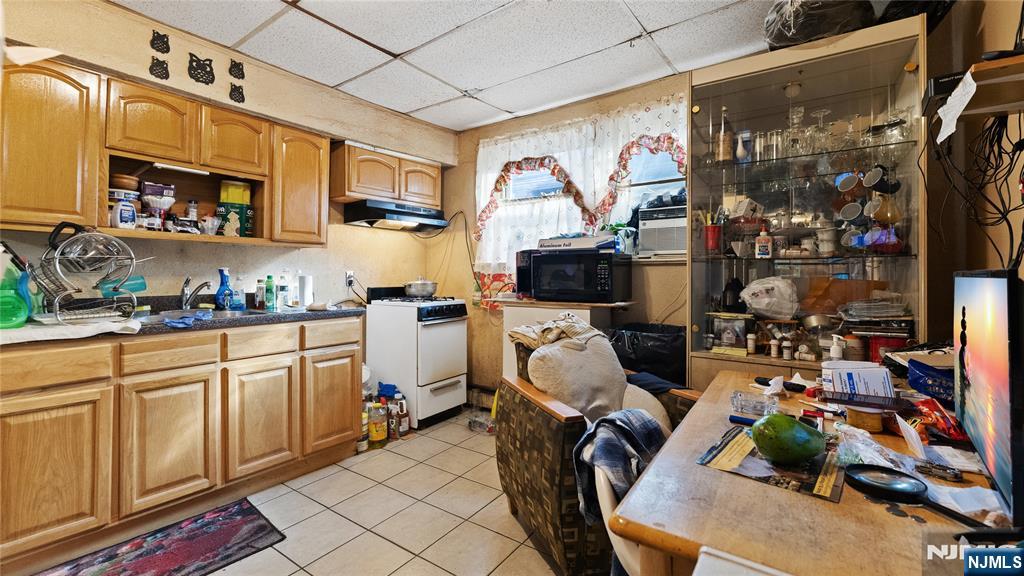 414 Market Street Paterson, NJ 07501 - Photo 3 of 9 a room with musical instruments