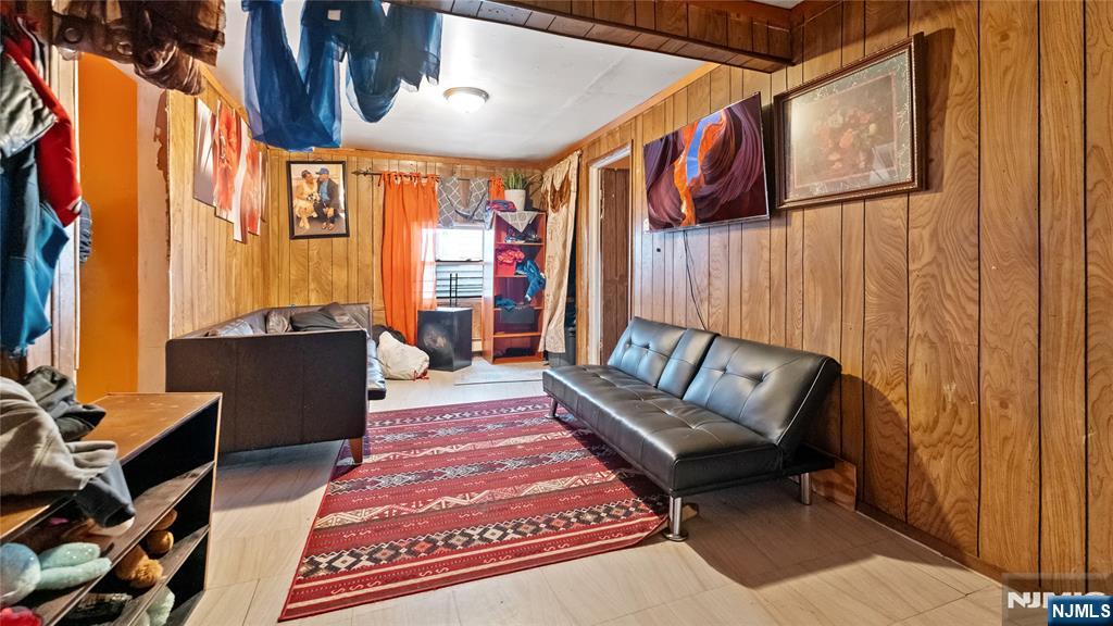 414 Market Street Paterson, NJ 07501 - Photo 8 of 9 a living room with furniture a rug and a window