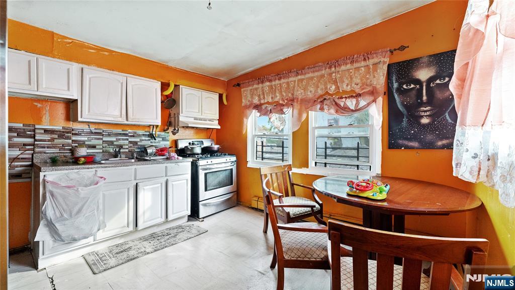 414 Market Street Paterson, NJ 07501 - Photo 9 of 9 a outdoor dining space with furniture and potted plants