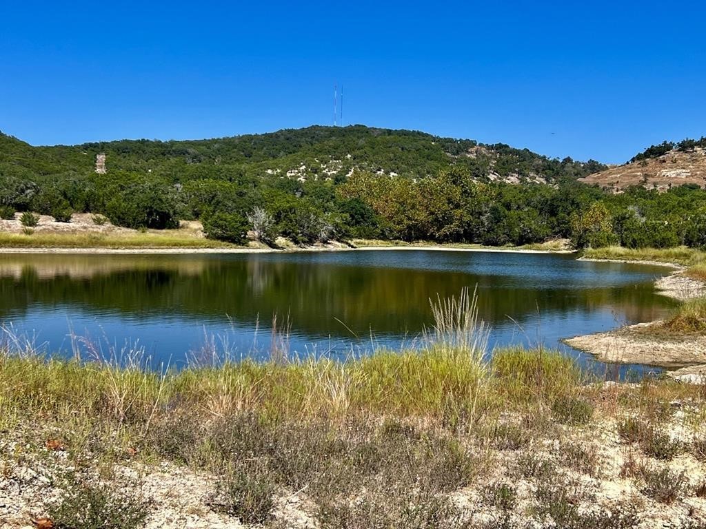 a view of a lake with mountains in the background