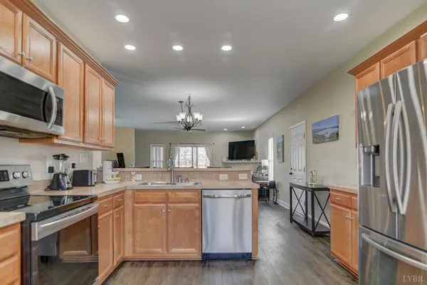 a spacious bedroom with a bed and a chandelier