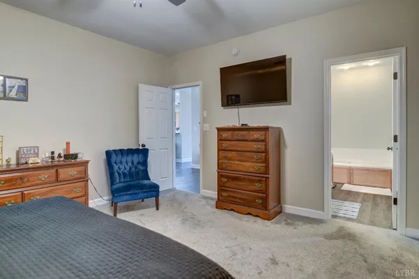 a front view of residential houses with yard and trees