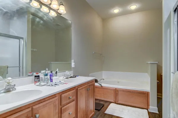 a view of a house with a yard and large tree