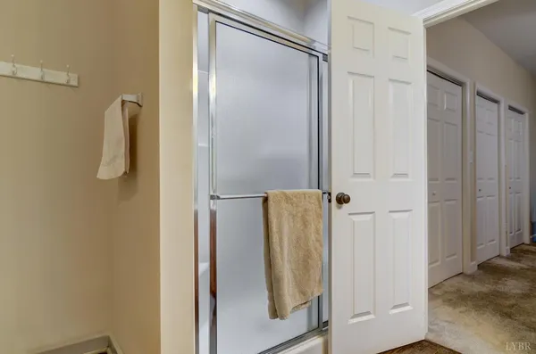 a view of a field with trees in the background