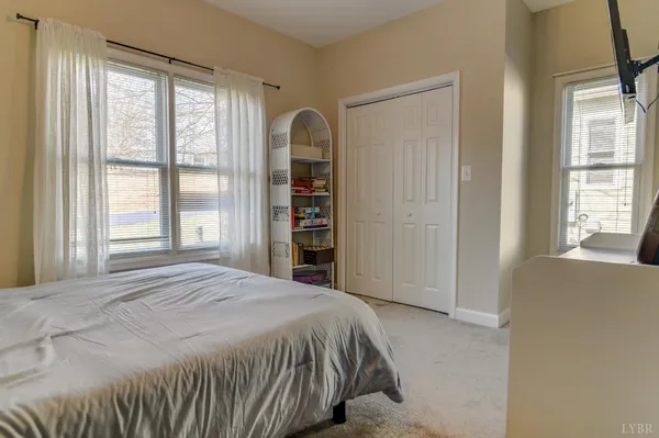 an aerial view of residential houses with outdoor space and river