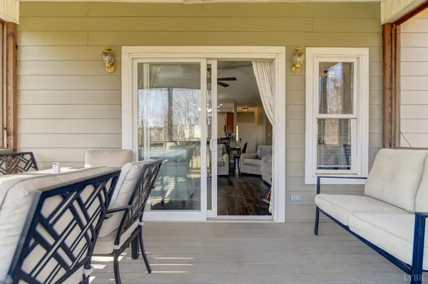 a kitchen with stainless steel appliances granite countertop a refrigerator a stove top oven a sink dishwasher and white cabinets with wooden floor