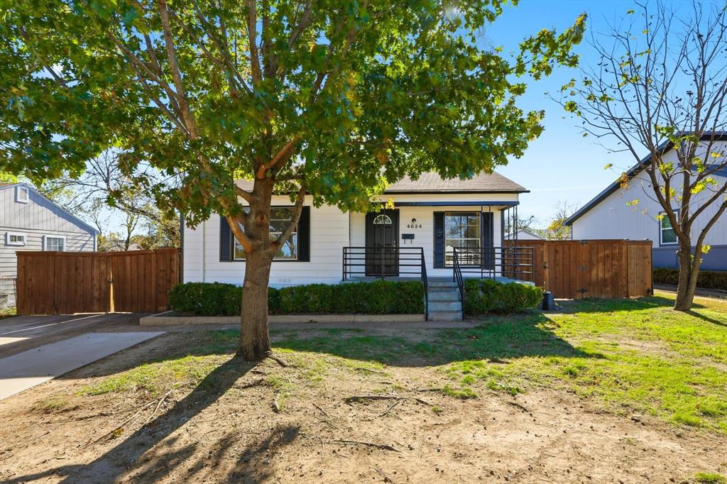 4024 Moler Street Dallas, TX 75211 - Photo 18 of 27 a front view of a house with garden