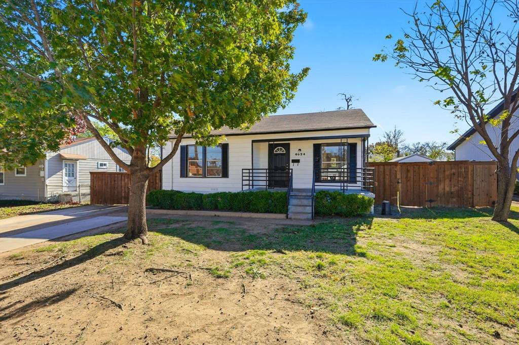 4024 Moler Street Dallas, TX 75211 - Photo 20 of 27 a front view of a house with garden