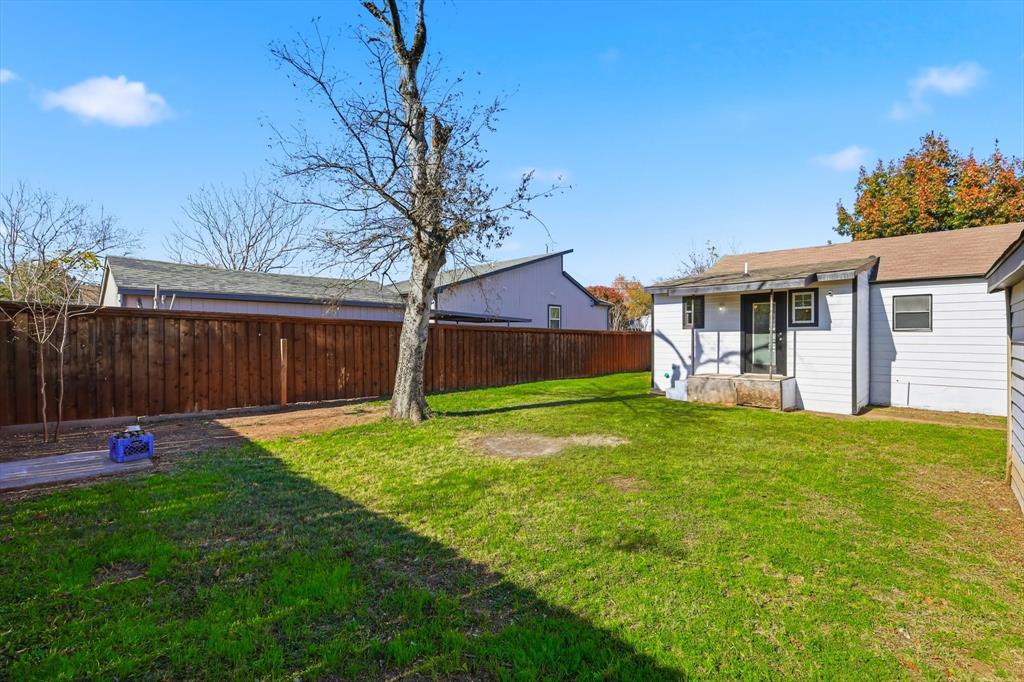 4024 Moler Street Dallas, TX 75211 - Photo 27 of 27 a backyard of a house with table and chairs