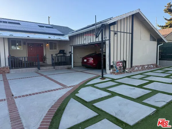 a front view of a house with yard