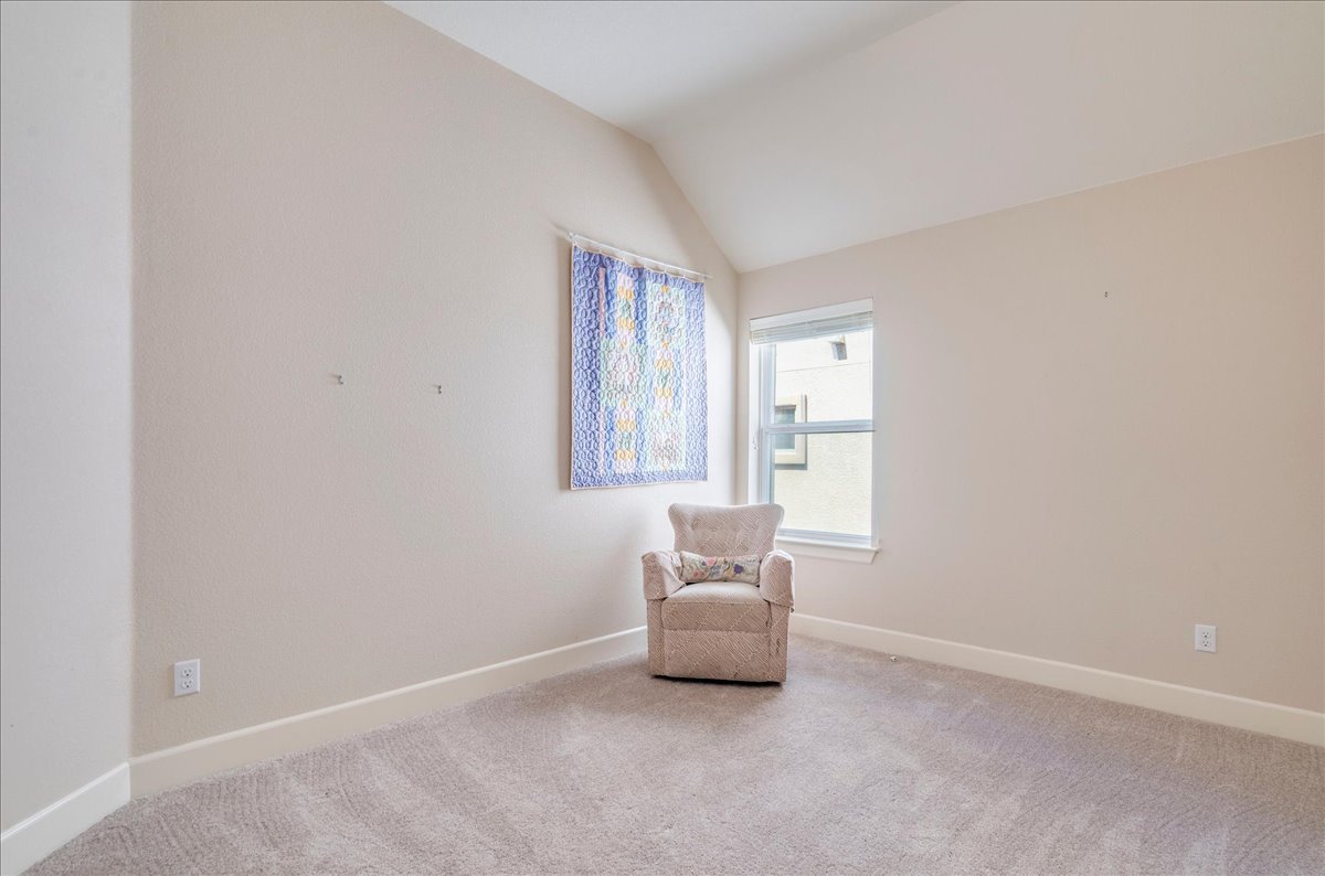 12909 Medina River Way Austin, TX 78732 - Photo 27 of 36 Vaulted ceilings and soft plush carpeting define this versatile bedroom.