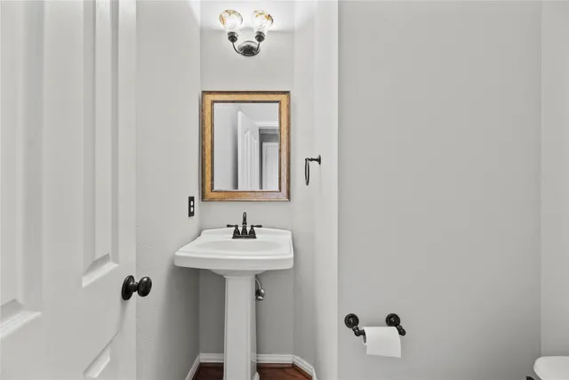a bathroom with a sink and mirror
