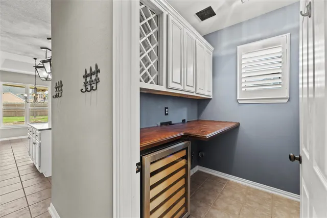 a bathroom with a double vanity sink a large mirror and shower