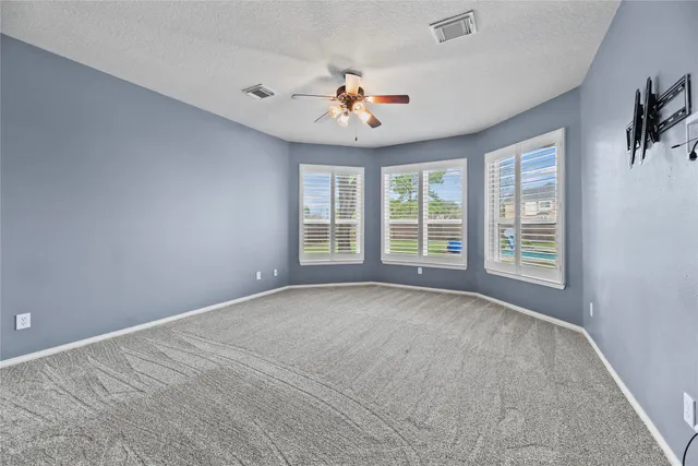 a spacious bathroom with a double vanity sink a mirror and a bathtub