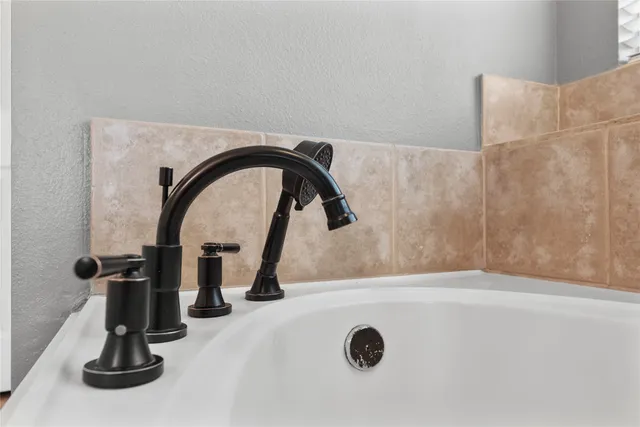 a view of staircase with white walls and a window