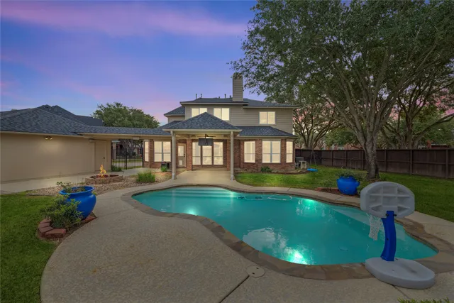 a view of a swimming pool with a patio