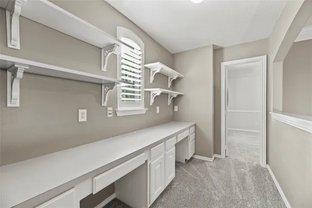 a bathroom with a bathtub shower sink vanity mirror and toilet