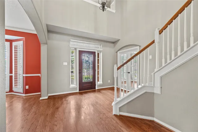 a view of an entryway with wooden floor