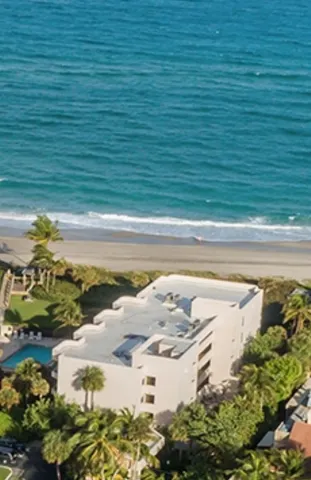 a view of a swimming pool with a yard