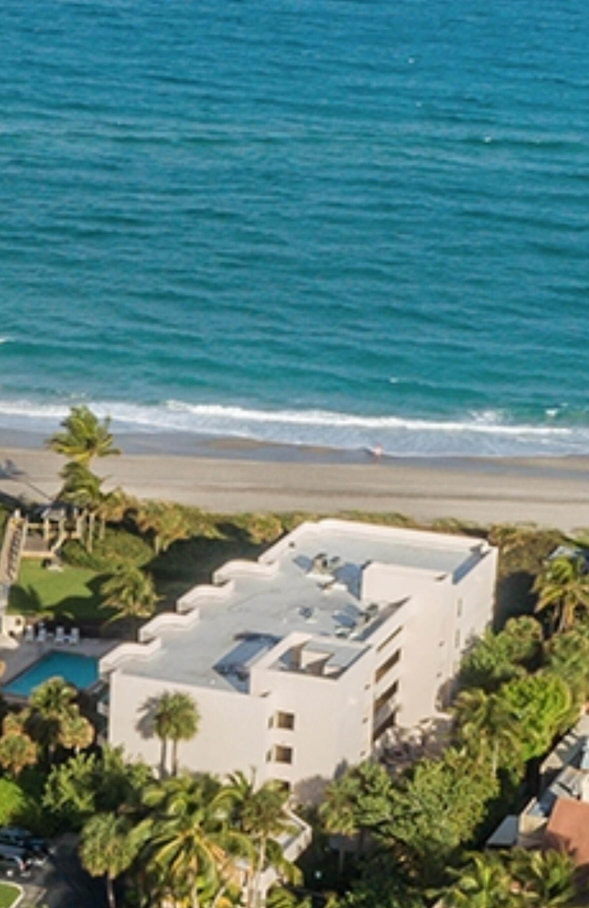 a view of a swimming pool with a yard