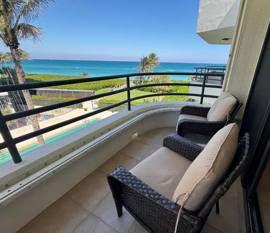 a bed sitting in a bedroom next to a window with lamp
