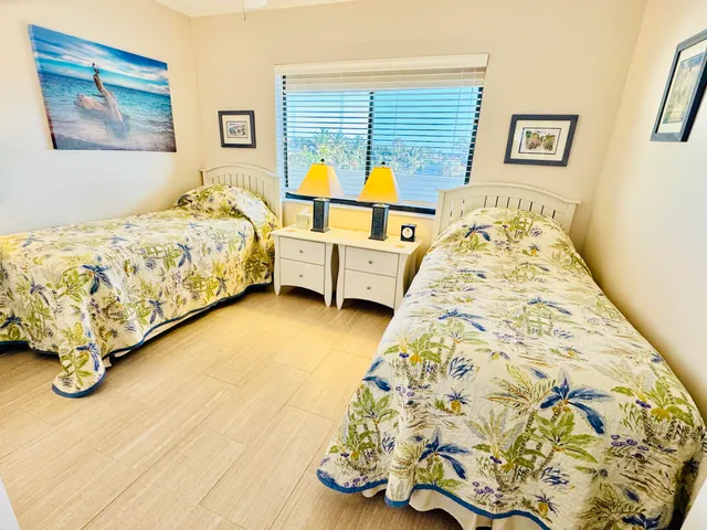 a kitchen with stainless steel appliances white cabinets and a sink