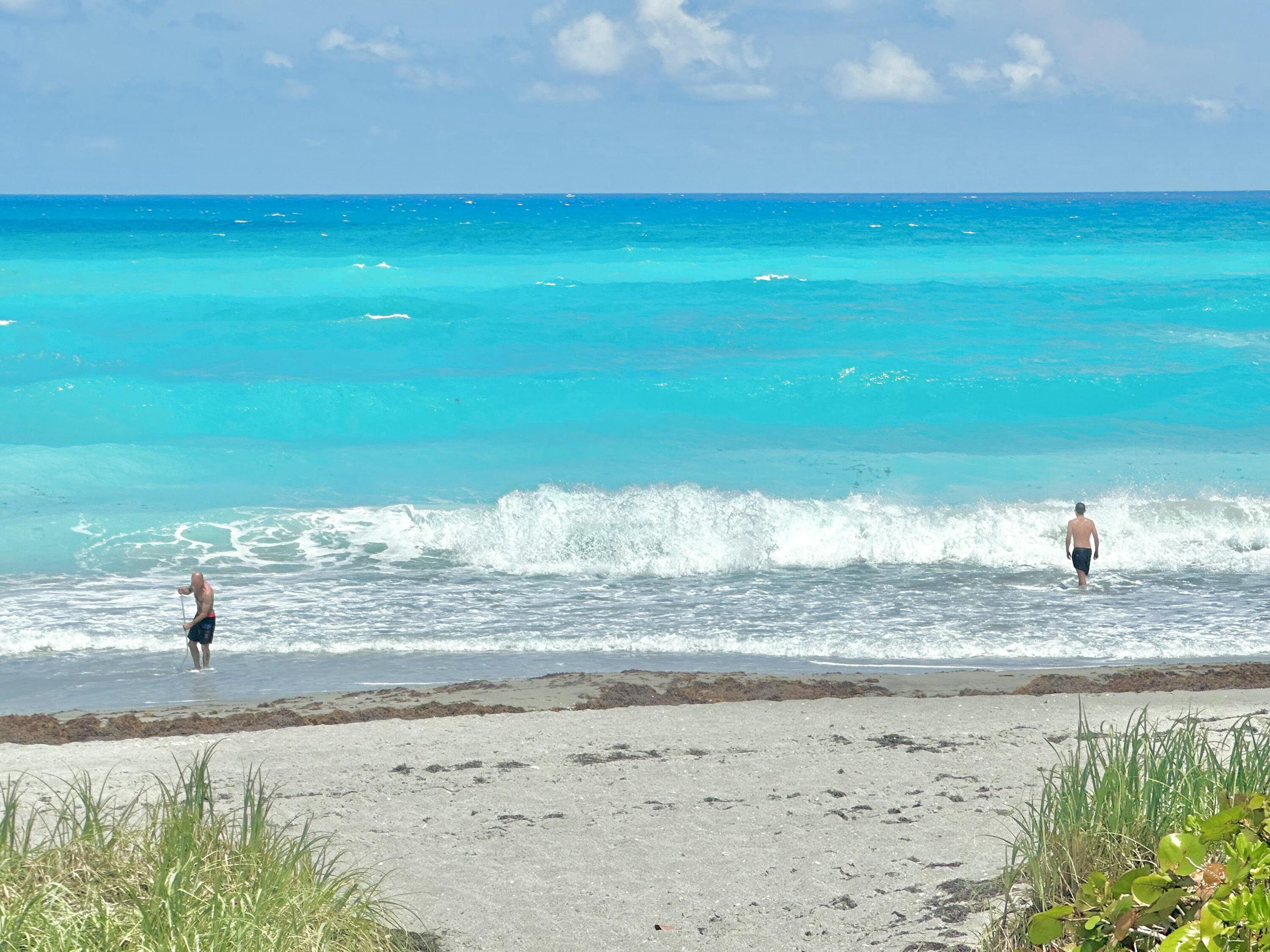 420 Celestial Way, Unit 403 Juno Beach, FL 33408 - Photo 5 of 25 a view of a lake with a beach