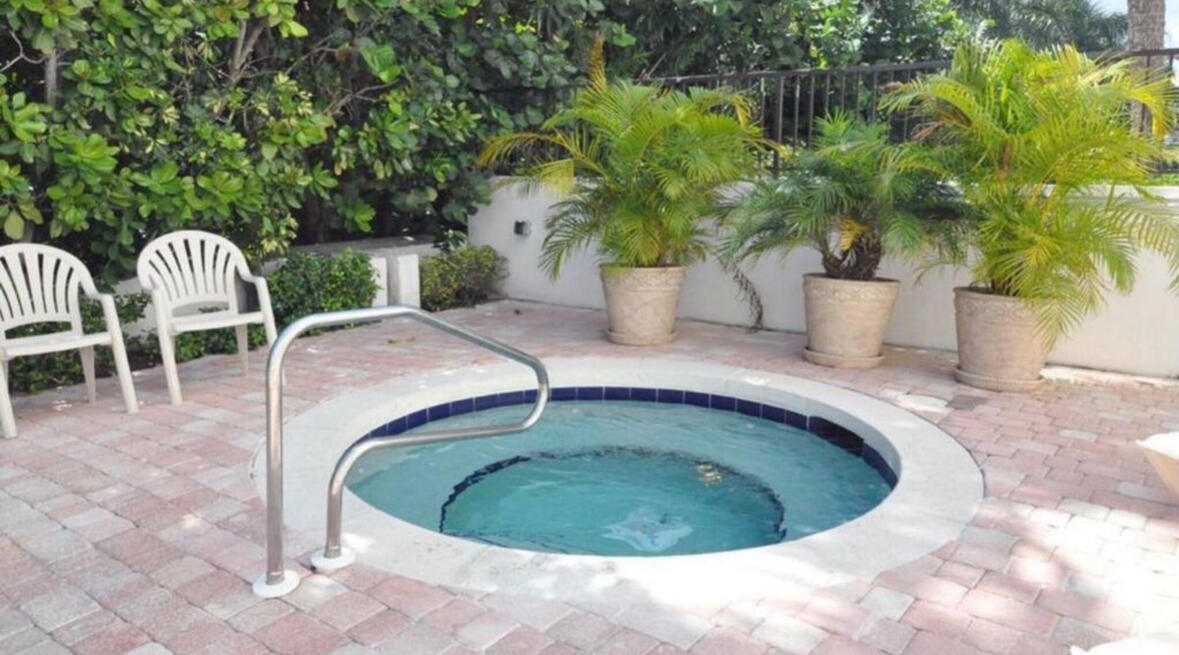 420 Celestial Way, Unit 403 Juno Beach, FL 33408 - Photo 9 of 25 a view of a swimming pool with a sitting space