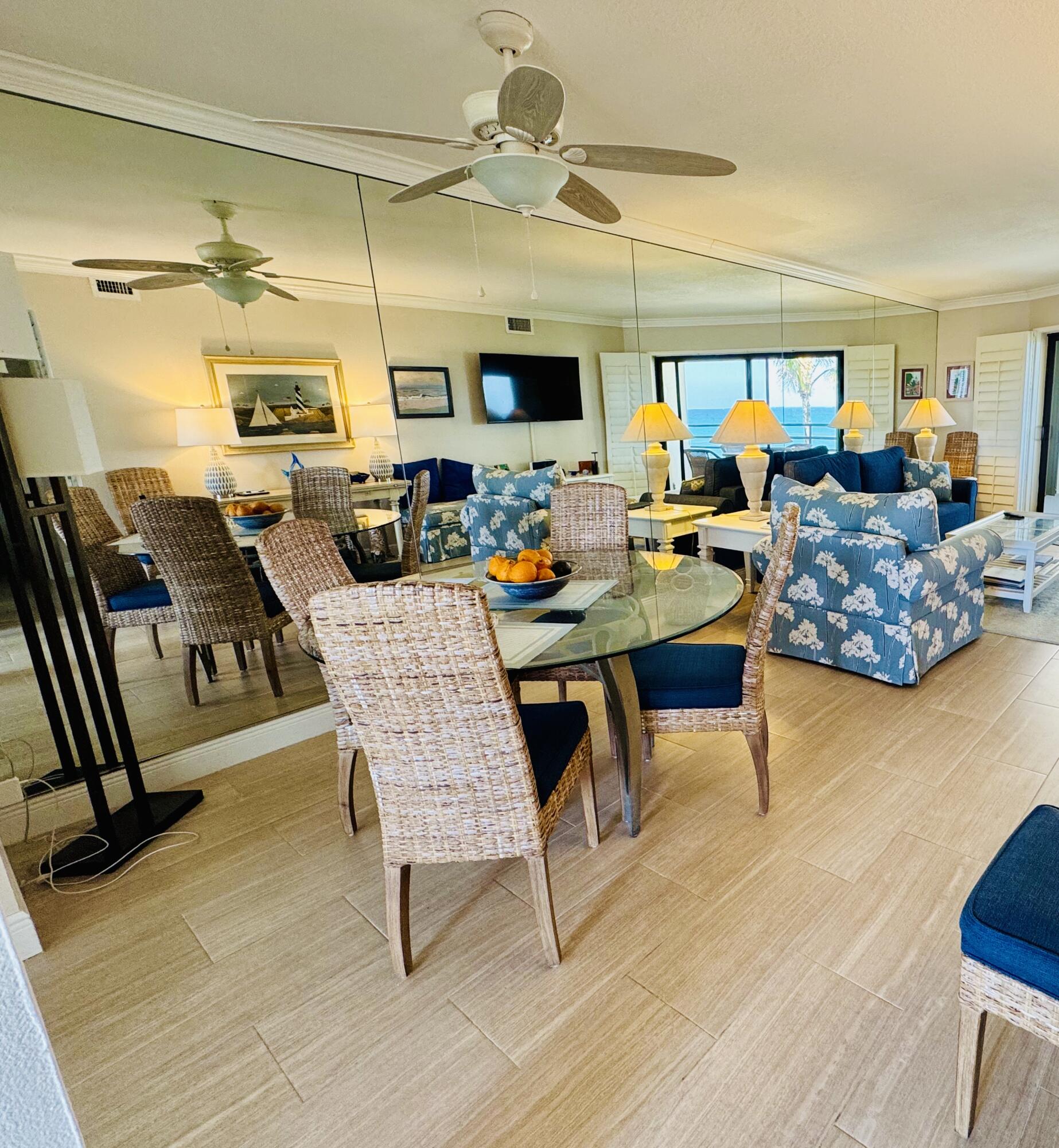 420 Celestial Way, Unit 403 Juno Beach, FL 33408 - Photo 10 of 25 a outdoor space with furniture a flat screen tv