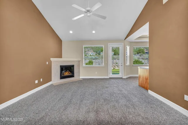 a large kitchen with stainless steel appliances granite countertop a lot of counter space and a sink