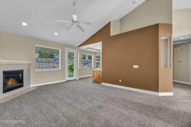 a large kitchen with stainless steel appliances granite countertop a sink and cabinets