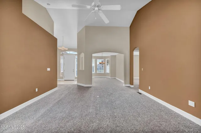 a kitchen with stainless steel appliances granite countertop a sink and a window