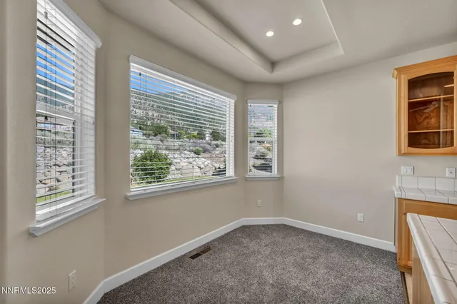 a bathroom with a sink double vanity granite tub and a mirror