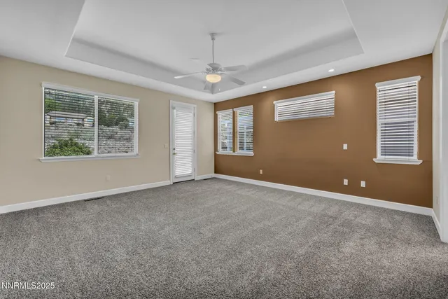 a front view of a house with yard and green space