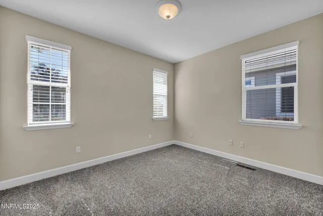 a view of a city with lush green forest