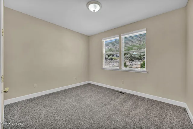 an aerial view of a house with a big yard