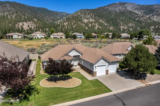 a view of a swimming pool with a yard